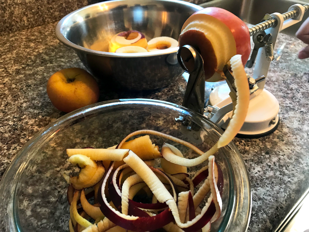 peeling apples with a peeler machine